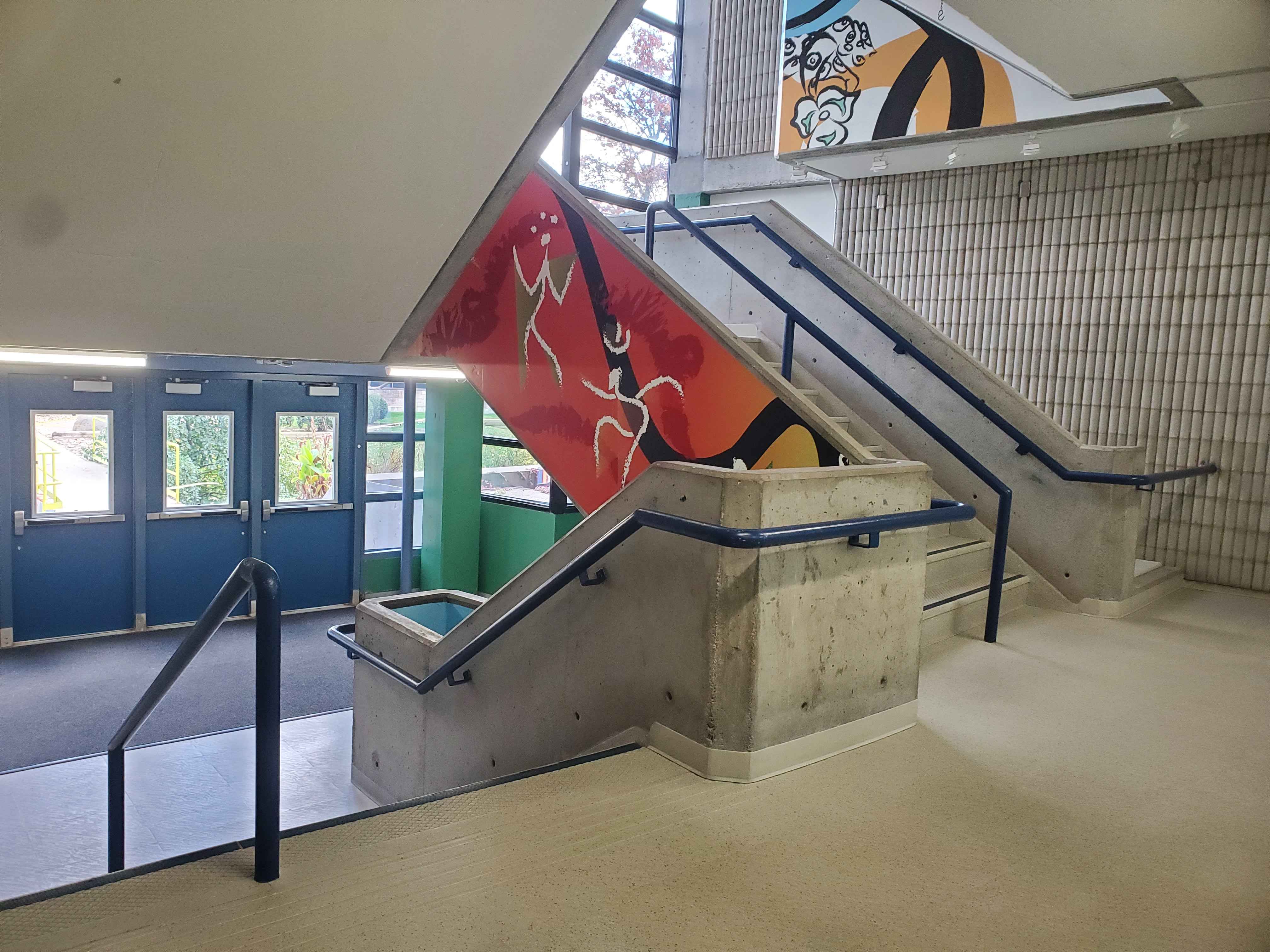In the B-wing there are concrete stairs that have colourful art on the sides of the stairs. This highlights the fact that this is an art school and adds a splash of colour to a rather dull area. A visual remodel to make this area more friendly and inviting would benefit this area.