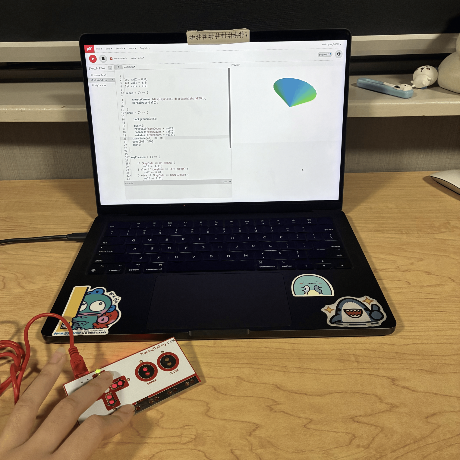 This was the third sketch where the user can change the direction that the 3D torus spins by clicking the arrow buttons on the Makey Makey. I changed the torus to a cone and made the bottom part large.